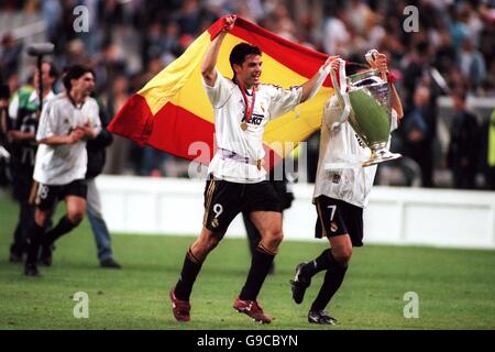 Real Madrid's Fernando Morientes (L) and Raul (R) celebrate winning the Champions League Final with the European Cup and Spanish national flag Stock Photo