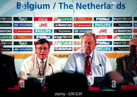 UEFA's Chief Executive Gerhard Aigner (L) and UEFA President Lennart Johansson (R) discuss their stance on the English football hooligans at a press conference at Liege this evening Stock Photo