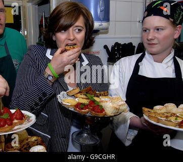 Cherie Blair, wife of the Prime Minister Tony Blair and President of the Barnardos Charity, tastes cakes during her visit to Dr Bs Restaurant and Coffe Shop in Harrogate, Wednesday 21 June 2006. Photo credit should read: John Giles/PA Stock Photo