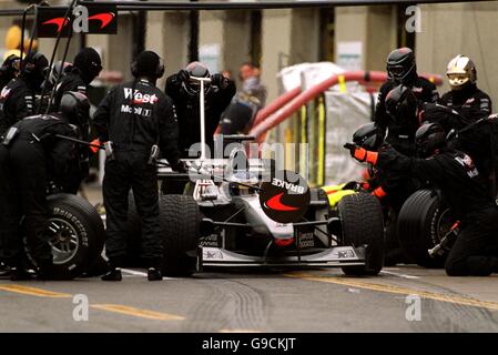 Formula One Motor Racing - Canadian Grand Prix. The McLaren pit crew work on Mika Hakkinen's car during a pit stop Stock Photo