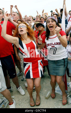 England football fans celebrate an England goal at Fan Fest in Nuremberg, Germany, during England's second World Cup game against Trinidad and Tobago. Stock Photo