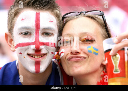 English and Swedish supporters in the stands before England play Sweden in the FIFA World Cup Groub B game at the FIFA World Cup stadium Cologne, Germany. Stock Photo