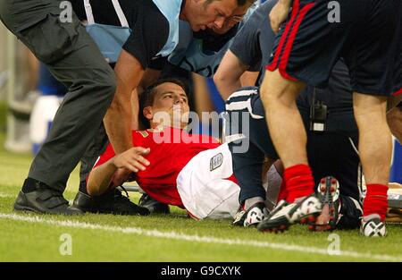 Soccer - 2006 FIFA World Cup Germany - Group B - Sweden v England - RheinEnergieStadion. England's Michael Owen goes down injured Stock Photo