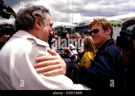 Formula One Motor Racing - Austrian Grand Prix. Canadian singer Bryan Adams (r) greets Placido Domingo (l) at the Austrian Grand Prix Stock Photo