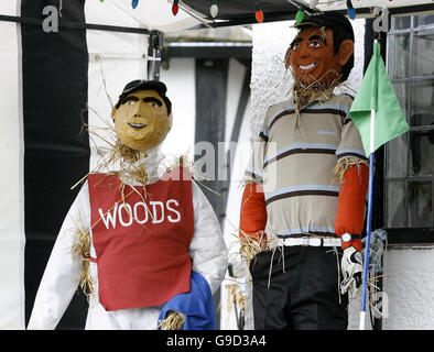 Tiger Woods and his caddie are re-created in the form of scarecrows for the Thornton Hough Scarecrow Festival at Wirral on Merseyside. Stock Photo