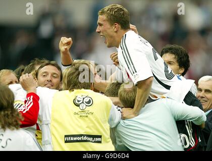 Soccer - 2006 FIFA World Cup Germany - Quarter Final - Germany v Argentina - Olympiastadion. Germany's Lukas Podolski celebrates with his team mates after victory over Argentina Stock Photo