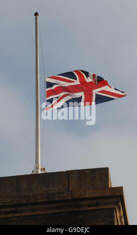 A flag flies at half mast on top of King's Cross Station in London Stock Photo