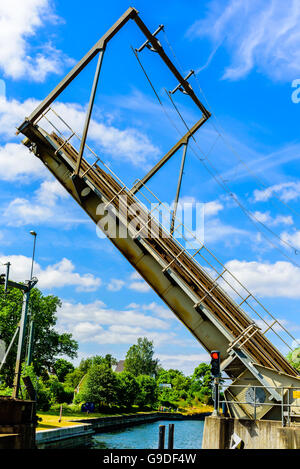 Double track railway bascule bridge or drawbridge opening or closing over a canal. Stock Photo