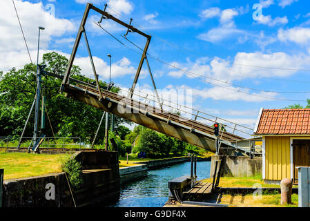 Double track railway bascule bridge or drawbridge opening or closing over a canal. Stock Photo