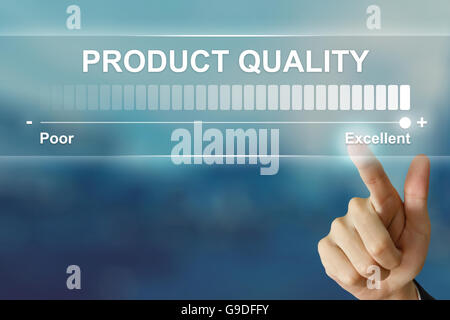 business hand pushing excellent product quality on virtual screen interface Stock Photo