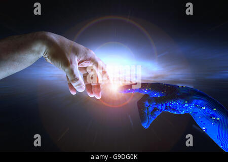 AI hand reaches towards a human hand as a spark of understanding technology reaches across to humanity. Artificial Intelligence Stock Photo