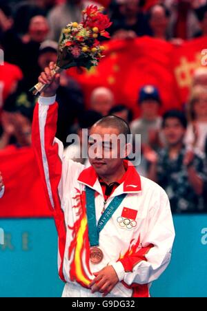 China's Guoliang Liu acknowledges the crowd after winning Bronze Stock Photo