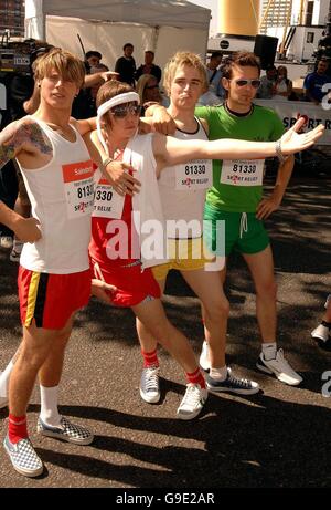 The four members of the pop group McFly; Dougie, Danny, Tom and Harry (left to right) line up for the Sport Relief Mile along the Embankment in Central London. Stock Photo