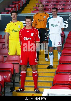 Liverpool's Xabi Alonso (left to right), Steven Gerrard, Jose Reina and Jamie Carragher display the new kits at Anfield Stadium, Liverpool. Stock Photo