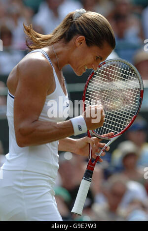 France's Amelie Mauresmo celebrates her 6-1, 3-6, 6-3 victory during the quarter final match against Russia's Anastasia Myskina at The All England Lawn Tennis Championships at Wimbledon. Stock Photo