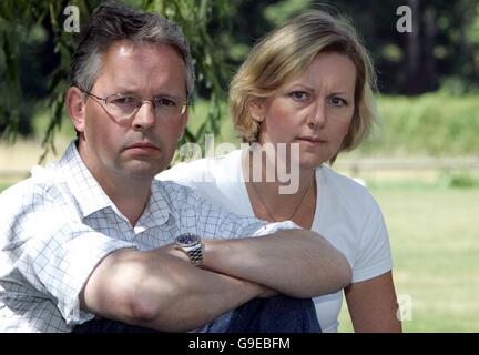 David Bermingham, one of three British bankers facing extradition to face trial in the USA, and his wife Emma sit in the garden of his home in Goring-on-Thames. Stock Photo