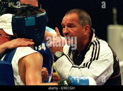 Sydney 2000 Olympics -Boxing - Men's 63.5 KG. Germany's Kay Huste gets some last minute advice from coach Karl-Heine Krager before going on to beat Argentina's Victor Hugo Castro Stock Photo