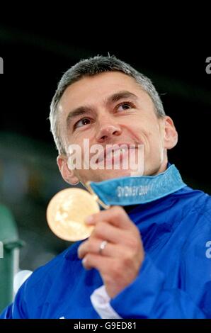 Great Britain's Jonathan Edwards is pleased as punch with his gold medal Stock Photo