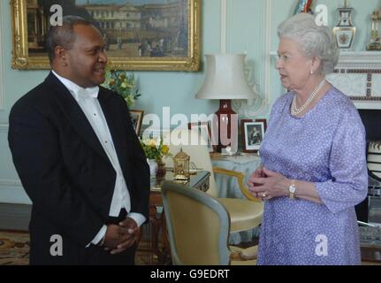 Britain's Queen Elizabeth II receives His Excellency The High Commissioner for the Solomon Islands Mr. Joseph Ma'ahanua at Buckingham Palace. Stock Photo