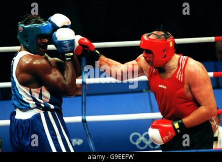 Sydney 2000 Olympics - Boxing - Men's 91KG plus. Great Britain's Audley Harrison on his way to victory against Italy's Paolo Vidoz Stock Photo