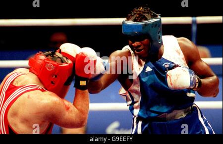 Sydney 2000 Olympics - Boxing - Men's 91KG plus. Great Britain's Audley Harrison on his way to victory against Italy's Paolo Vidoz Stock Photo
