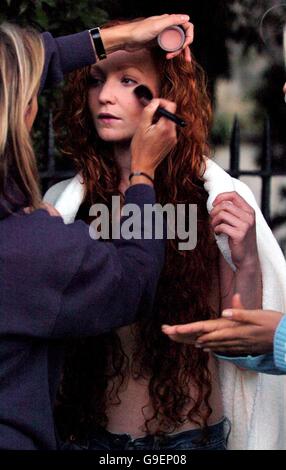 Phoebe Thomas, 23, from London, has her make up adjusted before she rides a white horse posing as a modern day Lady Godiva in Oxford town centre, whilst filming a very modern re-telling of the Lady Godiva legend. Stock Photo