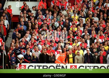 Soccer - FA Carling Premiership - Arsenal v Manchester United. The Arsenal fans look on as Manchester United's David Beckham takes a corner Stock Photo