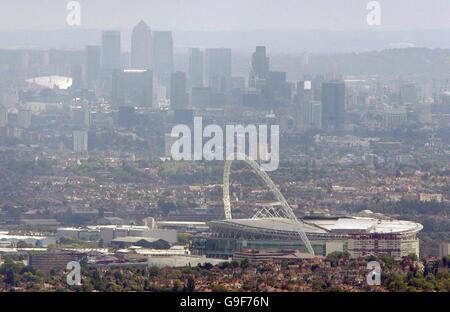 Aerial view of the new Wembley soccer stadium seen from the air with the Canary Wharf and the Millennium Dome in the background. Stock Photo