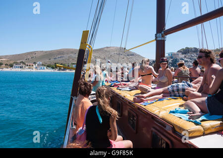 Passengers relaxing on 3 island cruise from Kos, Pserimos, The Dodecanese, South Aegean Region, Greece Stock Photo