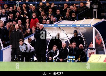 Soccer - FA Carling Premiership - Chelsea v Derby County. Derby County Assistant Manager Colin Todd (second l) and manager Jim Smith (c) watch in despair as they suffer defeat Stock Photo