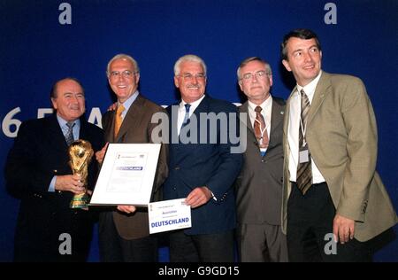 FIFA President Sepp Blatter (l) celebrates the German's being awarded the 2006 World Cup with Franz Beckenbauer (2nd l) and the rest of the German delegation Stock Photo