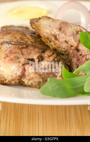 Roasted chicken liver with vegetable on wooden background Stock Photo