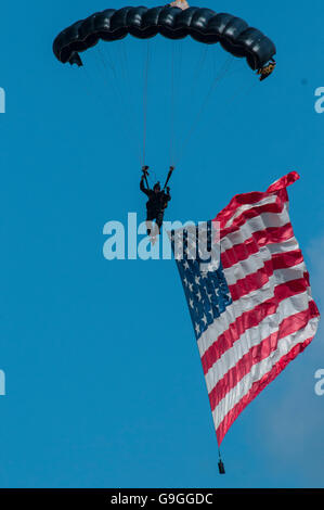 A member of the US Special Operations Commando Team parasails over the crowd athe Joint Base Andrews Airshow 2015 Stock Photo