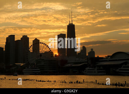 A view of Navy Pier and the John Hancock Tower as seen from Lake Michigan aboard a Seadog cruise at sunset in Chicago, IL, USA Stock Photo