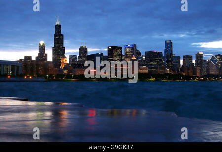 Downtown Chicago skyline along Lake Michigan at dusk including the Willis Tower as seen from the Museum Campus Stock Photo