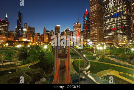 Downtown Chicago skyline at dusk including the Willis Tower as seen from a playground in Maggie Daley Park in Chicago, IL, USA Stock Photo