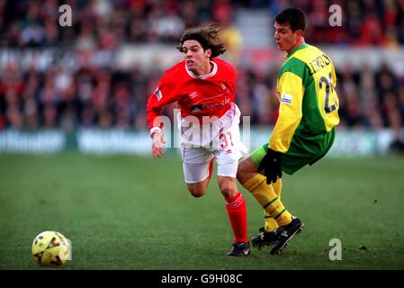 Soccer - Nationwide League Division One - Nottingham Forest v Norwich City. L-R Nottingham Forest's Ben Olsen hurdles the challenge off Norwich City's Chris Llewellyn Stock Photo