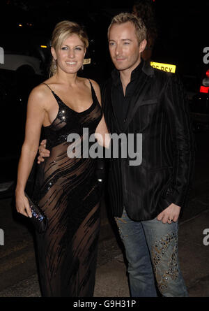 Hofit Golan and designer Scott Henshall arrive for the Gina London Fashion Week party at the Dorchester Hotel, central London. Stock Photo