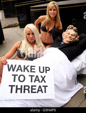 Sarah Whitefoot and Karen McKay hold a 'bed tax' protest near to the Labour Party Conference at the GMEX Centre in Manchester. Stock Photo