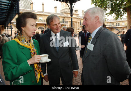 The Princess Royal talks to recently retired race horse trainer, Martin Pipe (right) and the Chief Executive of the Home Of Rest for Horses, Brigadier Paul Jepson at the Royal Mews in central London to rebrand the world's oldest horse charity, set up to care for the animals working on the streets of 19th century London, was rebranded today. Stock Photo