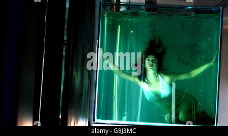 Artist Anna Vickers goes underwater in a large aquatic tank at a ...
