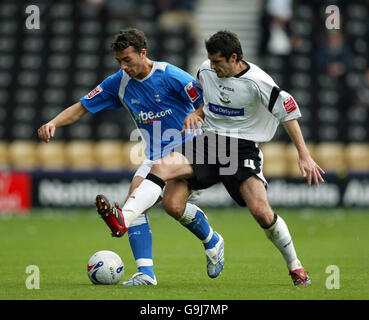 Soccer - Coca-Cola Championship - Derby v Birmingham - Pride Park. Birmingham's Stephen Kelly (left) tussles with Derby's Martin Taylor during the Coca-Cola Championship match at Pride Park, Derby. Stock Photo