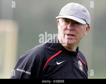 Soccer - Manchester United training session - Carrington. Manchester United manager Sir Alex Ferguson overlooks his players during a training session at Carrington training ground. Stock Photo