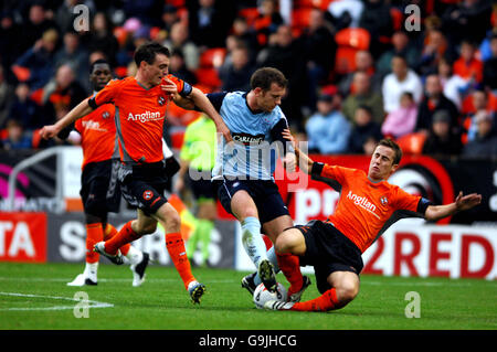 Dundee United's Mark Kerr and Greg Cameron battle with Rangers' Charlie Adam Stock Photo