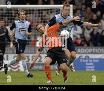 Dundee United's Greg Cameron tussles with Rangers Charlie Adam (right) during the Bank of Scotland Premier League match at Tannadice Park, Dundee. Stock Photo