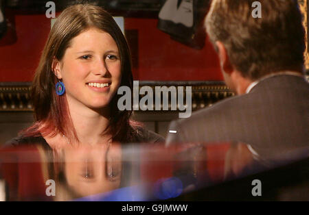 Josie Russell, 19, a teenager who survived a vicious hammer attack that killed her mother and sister, does a television interview at the Hard Rock Cafe in London, after winning a CosmoGIRL! of the Year Award for her work with wildlife charity the Born Free Foundation, which she first got involved with two years after the attack. Stock Photo