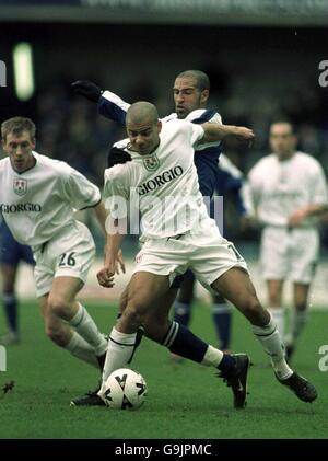 Soccer - Nationwide League Division Two - Millwall v Peterborough United. Millwall's Steven Reid is pulled off the ball by Peterborough United's Jason Lee Stock Photo