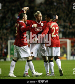 Manchester United's Kieran Richardson (right) celebrates with team-mates Alan Smith (centre) and Wayne Rooney after scoring against FC Copenhagen during the Champions League group F match at Old Trafford, Manchester. Stock Photo