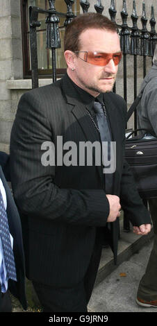 U2 frontman Bono leaves the High Court in Dublin, after giving evidence at an appeal launched by the bands former stylist to keep the Stetson hat she claims the band gave her. Stock Photo