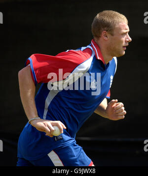 Cricket - England practice session - Sardar Patel Stadium. England's Andrew Flintoff runs up to bowl during a nets practice session at the Sardar Patel Stadium, Ahmedabad, India. Stock Photo